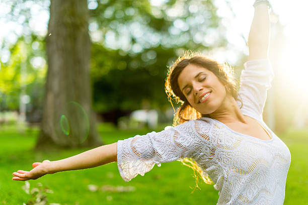 istock Serene young woman expressing freedom in nature 187633870
