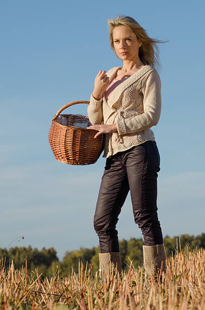 istock young pretty woman with basket 187639154