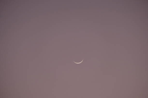 istock crescent moon in the evening sky. Hilal. 1876394243