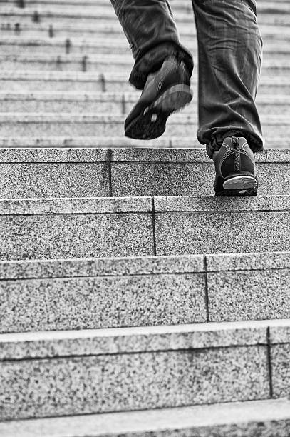 istock Man walking up the stairs 187639687