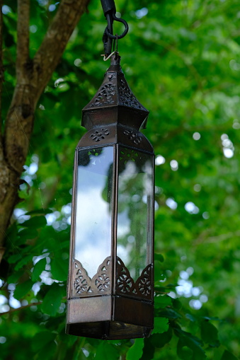 classic retro style hanging decorative lamps in a tropical garden.