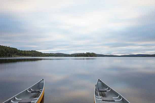 istock Canoes on a calm lake 187643615