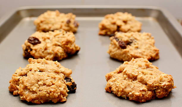 istock Oatmeal raisin cookies cooling on a baking sheet 187645028