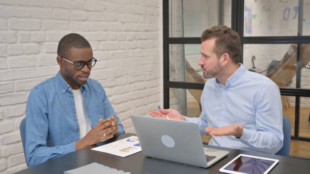istock Angry Man Talking with Male Worker in Office 1876454647
