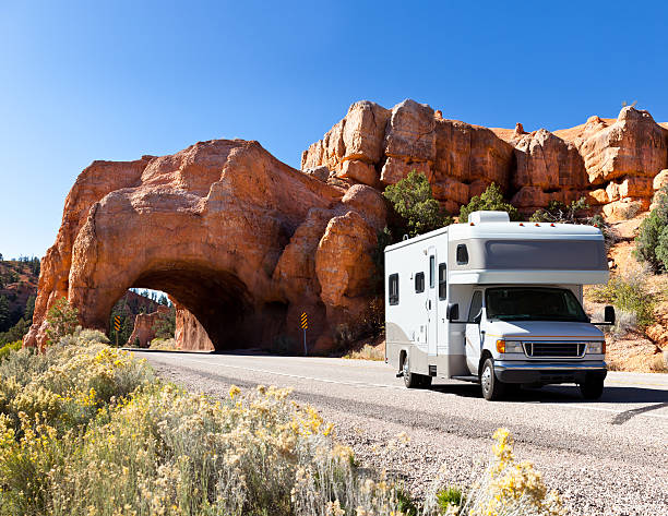 Driving motorhome through Bryce Canyon National Park USA http://farm4.staticflickr.com/3665/10572937095_e7871b7b85.jpg?v=0 bryce canyon stock pictures, royalty-free photos & images