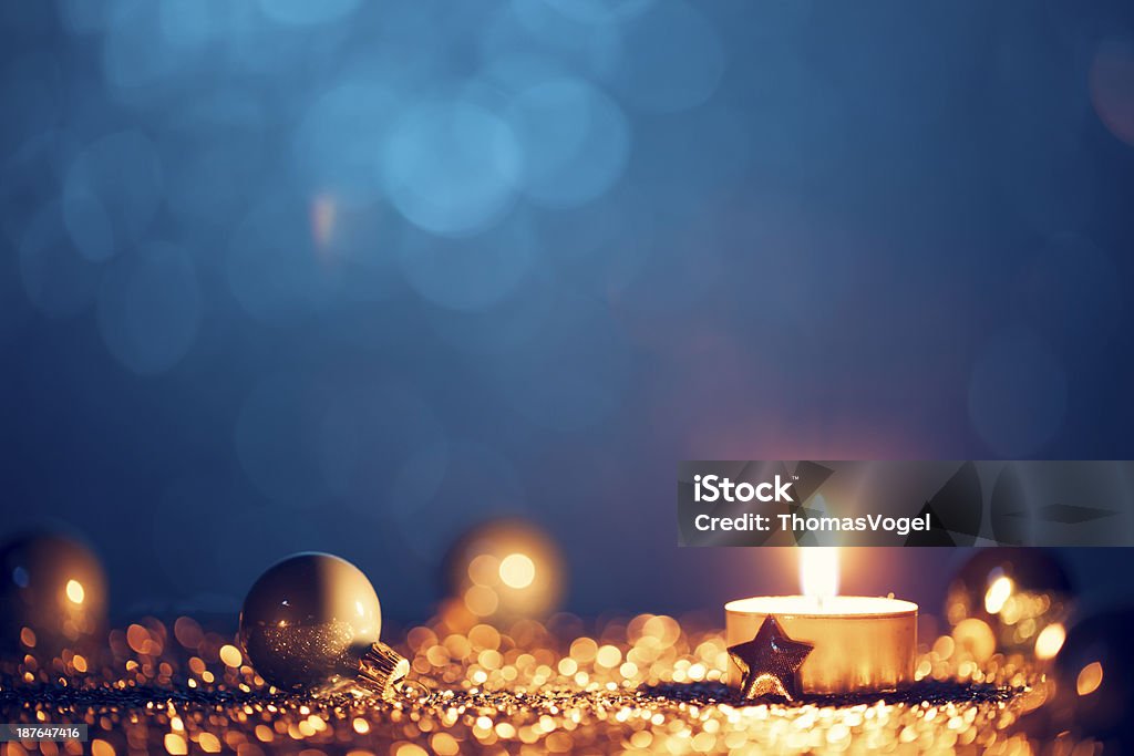 Gold candle and ornaments with blue background http://thomasvogel.eu/istock/is_christmas.jpg Christmas Stock Photo