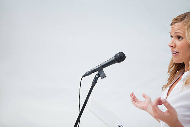 istock Business woman giving a talk 187647464