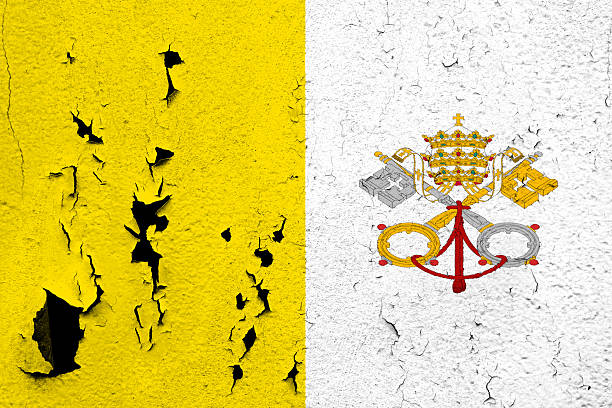 Flag of Vatican The flag of Vatican painted on a cracked and peeling wall. construction material torn run down concrete stock pictures, royalty-free photos & images