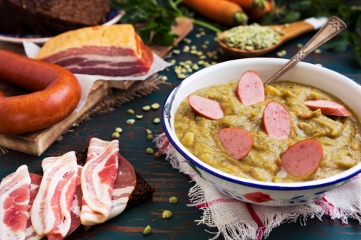 Hearty traditional Dutch pea soup with smoked sausage, rye bread and bacon.