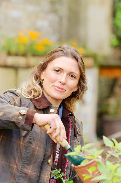 istock Young woman urban gardening 187648049