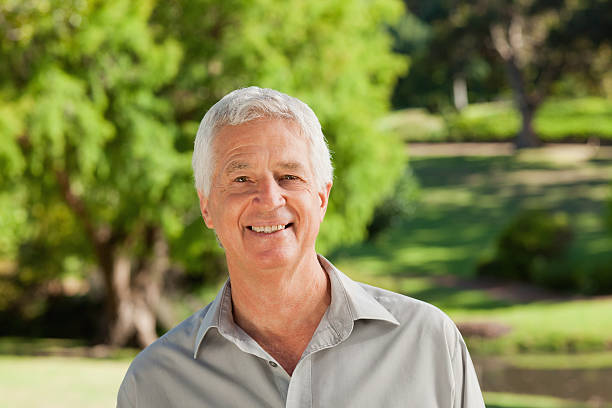 istock Man smiles at camera in the sunshine 187648394