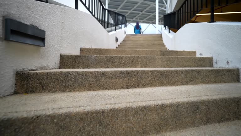 Person ascending a staircase