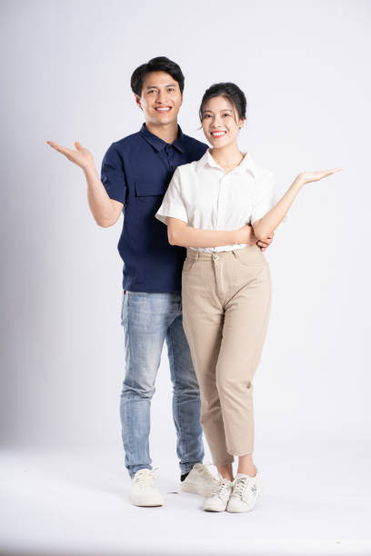 istock Image of an Asian couple posing on a white background 1876503537