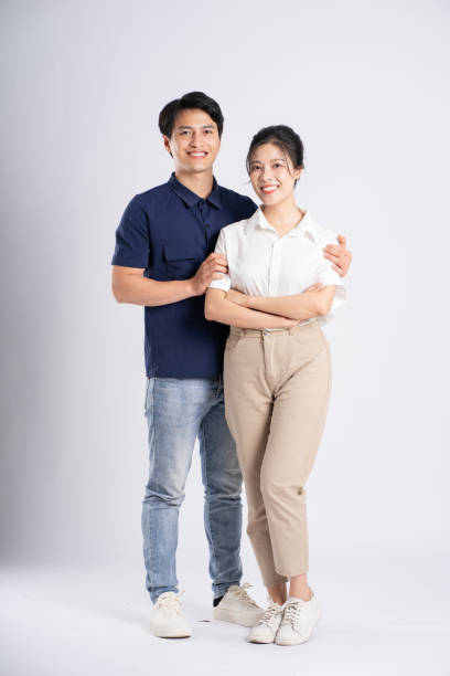 istock Image of an Asian couple posing on a white background 1876503547