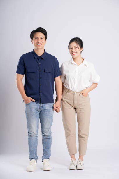 istock Image of an Asian couple posing on a white background 1876503556