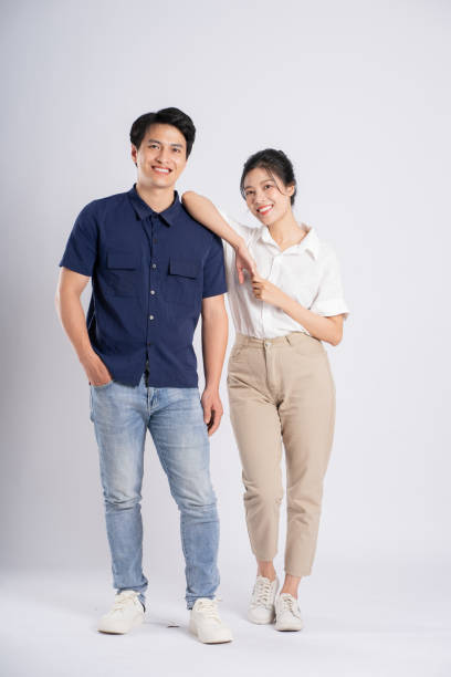 istock Image of an Asian couple posing on a white background 1876503568