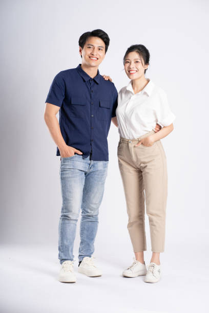 istock Image of an Asian couple posing on a white background 1876503569