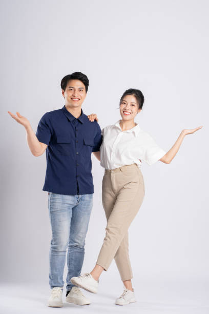 istock Image of an Asian couple posing on a white background 1876503587