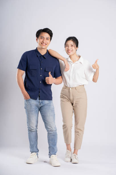 istock Image of an Asian couple posing on a white background 1876503604