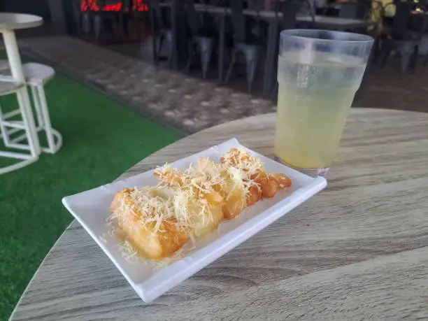 Photo of Fried Cassava Cheese with Grated Cheese,Sweetened Condensed Milk and Lime Cold Drink). Food And Drink Menu