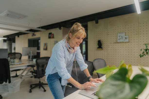 istock Busy young woman at her workplace 1876510063