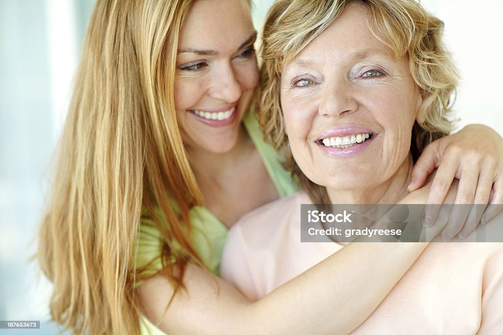 Showing her mother she cares A beautiful woman hugging her mother affectionately 30-39 Years Stock Photo