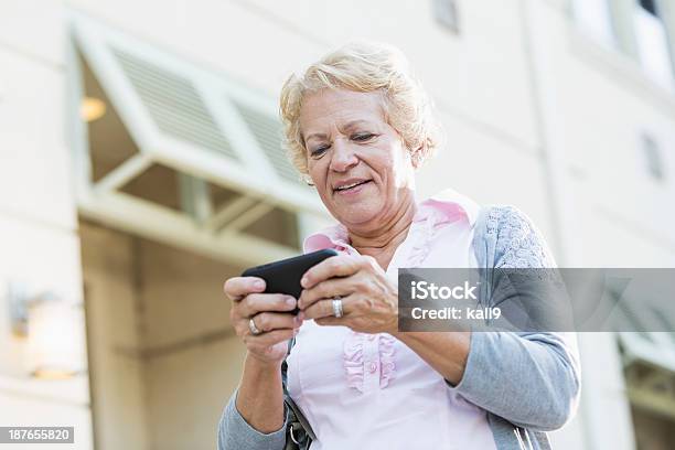Senior Woman Texting Stock Photo - Download Image Now - 70-79 Years, Active Lifestyle, Active Seniors