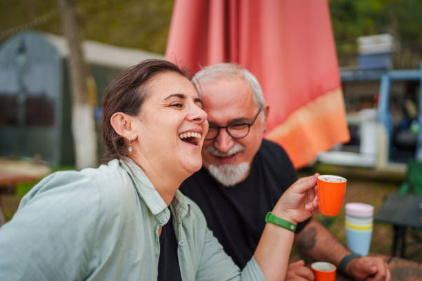 istock Happy couple having coffee at the camp. 1876560655