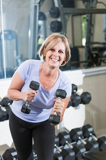 istock Mature woman at the gym 187656410