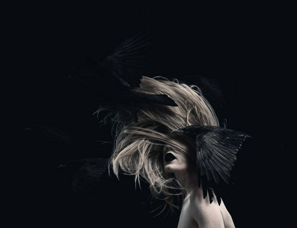 istock Young woman in motion with flying ravens 1876566250