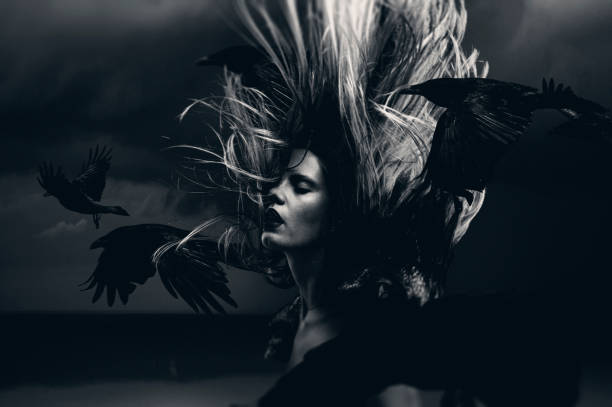 istock Young woman in motion with flying ravens 1876567293