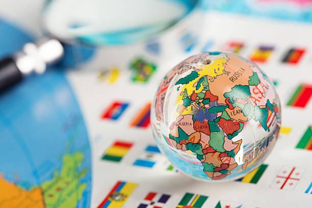 Glass globe on the flags Glass globe on the flags of the countries Study Abroad Countries stock pictures, royalty-free photos & images