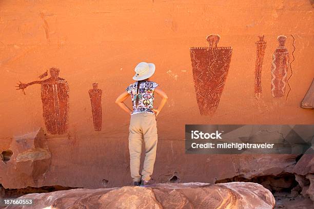 Hiker Admires Glen Canyon Pictographs Utah Stock Photo - Download Image Now - Adult, Ancient, Cave Painting