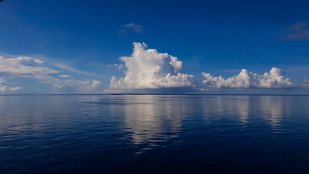 istock White Clouds in the middle of the sea 1876608752