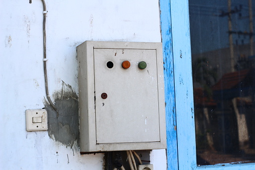 Castilla y León, Spain. Old-fashioned electrical plug and light switch.