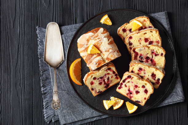 istock orange cranberry loaf with orange glaze, top view 1876620604