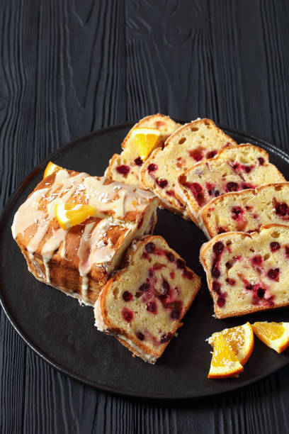 istock orange cranberry loaf with orange glaze, top view 1876621099