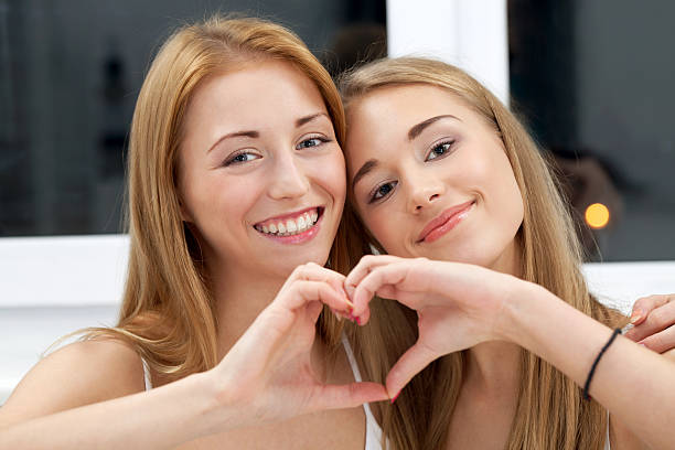 istock Best friends or sisters making a heart 187663696