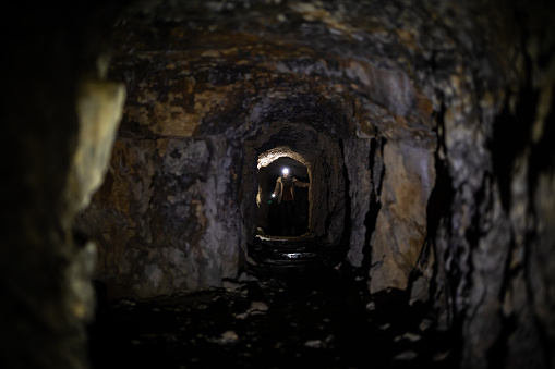 Geology Enthusiast Adult Woman Adventurer Discovery Underground Caves from First World War in European Alps