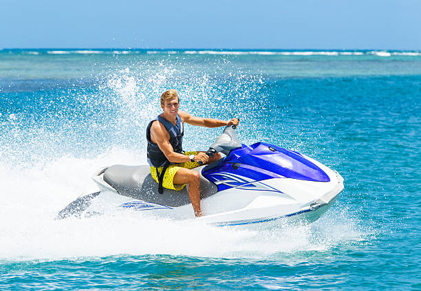 istock A young blonde man on a jet ski in the ocean 187663999