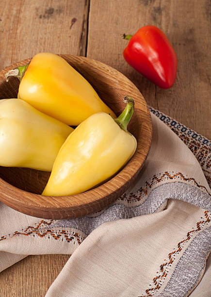 bell pepper on wooden dish stock photo