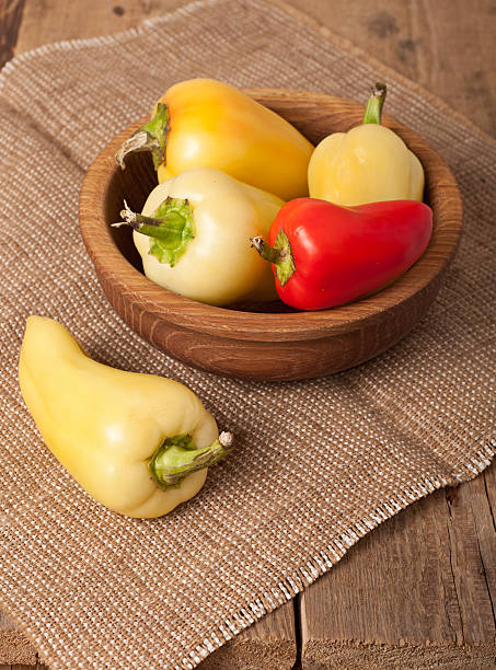 bell pepper on wooden dish stock photo