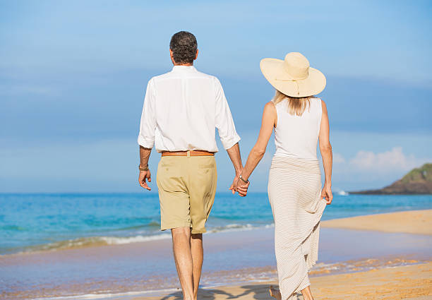 istock Romantic Couple Walking on the Beach 187665455
