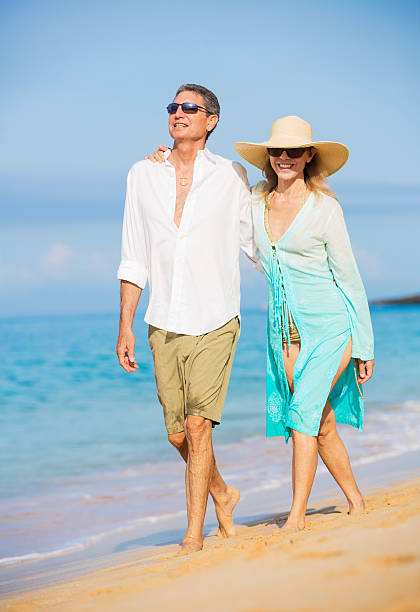 istock Romantic Couple Walking on the Beach 187665546