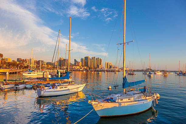 San Diego skyline and bay, California Setting sun cast a warm glow on the skyline of San Diego, California marina california stock pictures, royalty-free photos & images
