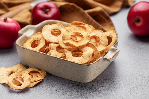 Dried apple chips. Dehydrated apples. Homemade dried organic apple sliced.