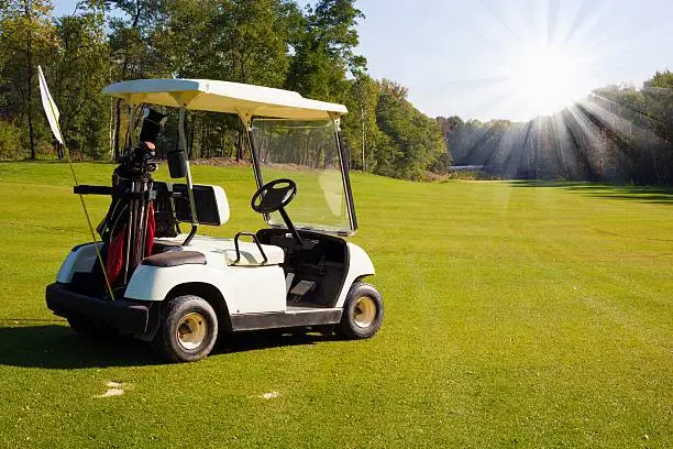 Golf-cart car on golf course landscape