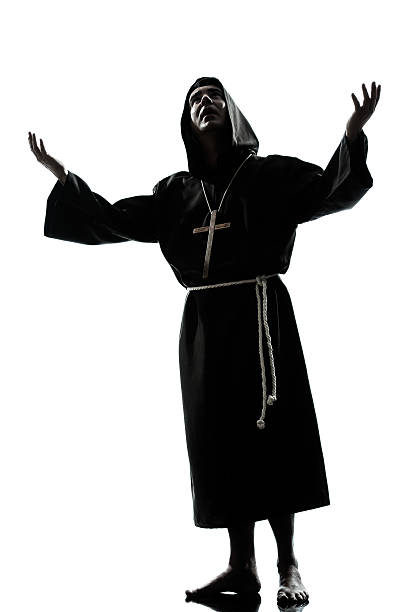 istock man monk priest silhouette praying 187671809