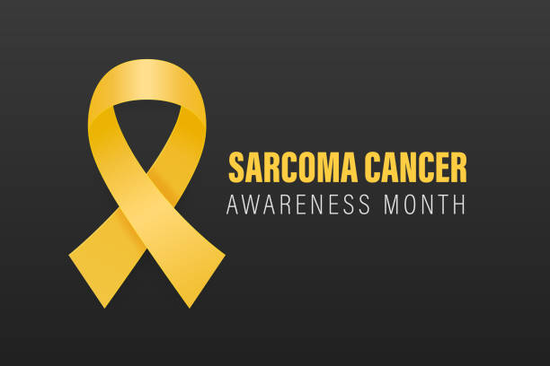 istock Sarcoma, Bone Cancer. Vector Banner, Card, Placard, Design Template with Realistic Yellow Ribbon on a Black Background. Sarcoma Cancer Awareness Month, July. World Bone Cancer Day Concept 1876728473