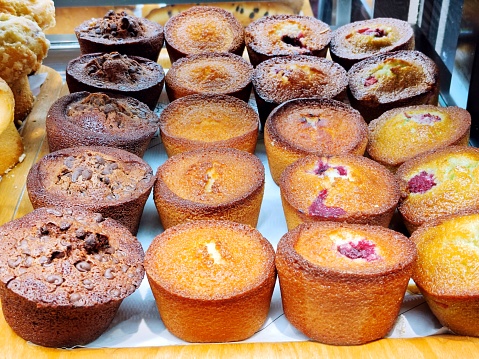 yummy assortment baked pastry in bakery. Various Different Types Of Sweet Cakes In Pastry Shop Glass Display. Good Assortment Of Confectionery. buffet with many desserts.